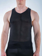 A man wearing a black Full Kit Gear Captivity Tank Top made of a textured, ribbed knit fabric.