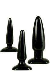 Three glossy black anal trainer toys of varying sizes stand against a white background.