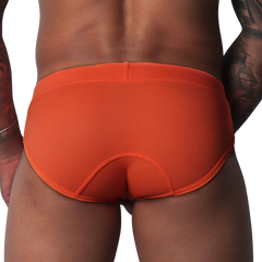 Bright orange, textured athletic brief with a wide waistband and contoured back panel seams.