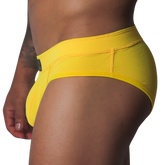 Bright yellow low-rise brief in textured, breathable honeycomb mesh fabric with a wide supportive waistband.