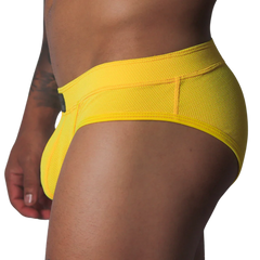 Bright yellow low-rise brief in textured, breathable honeycomb mesh fabric with a wide supportive waistband.