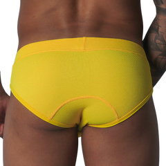 Bright yellow, textured mesh brief with curved seam detailing on the back, shown from behind.