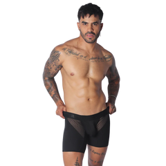 Black trunk underwear featuring a solid fabric body with sheer mesh side panels and a wide elastic waistband.