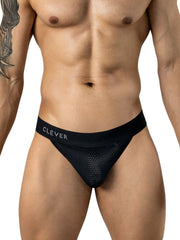 A man modeling black Clever thong underwear with a perforated mesh front pouch and branded elastic waistband.