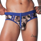 Blue camo swim brief with solid blue waistband, matching drawstring, and panel detailing on a fitted athletic cut.