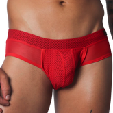 Vibrant red men's low-rise brief featuring sheer mesh panels and a textured mesh pouch for a breathable, athletic fit.