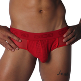 Red mesh jockstrap with a branded elastic waistband, featuring sheer side panels and a supportive contour pouch.