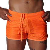 Bright orange athletic mesh shorts with a drawstring waistband and side pockets.
