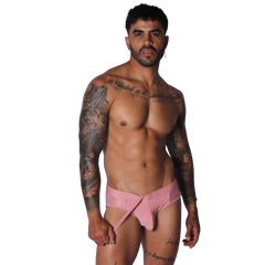 Dusty pink swim brief with a wrap-around asymmetrical front strap and textured side panels.
