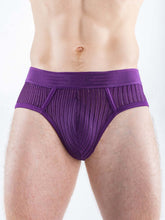 Full Kit Gear purple briefs with a textured, open-weave pattern and a wide waistband worn by a model.