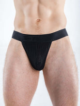 Man wearing Full Kit Gear black mesh thon underwear with a wide elastic waistband against a plain background.