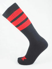 Fk sport black tube sock featuring bold red stripes and a small red logo on the toe in athletic fabric