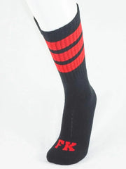 Black athletic tube sock with bold red stripes and matching fk logo on the toe for sports use