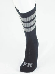 Black athletic tube sock with three gray stripes near top and silver fk logo embroidered on the toe for sports use
