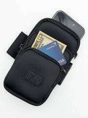 Black fk sport 3 pocket neoprene arm pouch with zippered compartments holding cash and phone