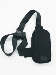Black nylon FK sport crossbody bag with adjustable strap and zipper closure for hands-free carrying