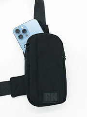 Black fk sport cross body bag in black with sleek minimalist design and durable fabric for everyday use