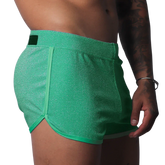 Gigo Flash green short with a shimmery fabric finish, side piping, and a branded waist tab.