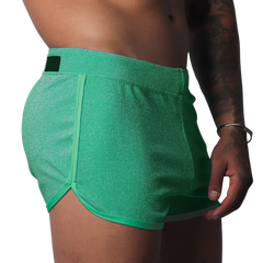Gigo Flash green short with a shimmery fabric finish, side piping, and a branded waist tab.