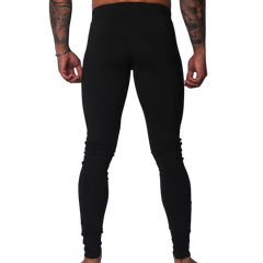 Back view of Gigo black, high-waisted, form-fitting Lycra leggings with a seamless, athletic design.