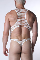 Rear view of a man wearing a white mesh bodysuit with a thong back against a plain white background.