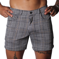 Black and white houndstooth print shorts with a subtle gold windowpane check, featuring a classic five-pocket design.