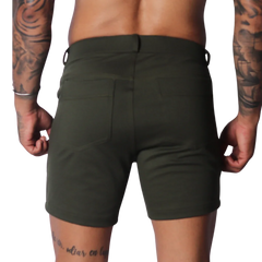 Form-fitting Sunday green short in a smooth, matte fabric with two back pockets and a clean, minimalist design.