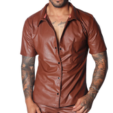 Brown short-sleeve button-down shirt in smooth faux leather with a classic collar and single chest pocket.