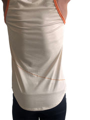 The perfect tank sand beige back view showing cream sleeveless top with orange trim and stitched lower back detail