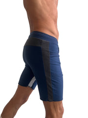 Navy blue tri-color ultra-flex yoga track shorts with dark gray side stripe and white hem accent for athletic use
