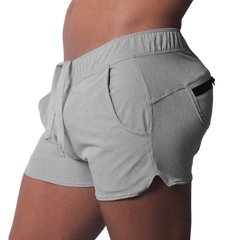 Gray short-length athletic shorts featuring an elastic drawstring waistband and a side pocket with a black zipper.