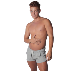 Light gray athletic-style shorts with an elastic drawstring waistband and curved hem, worn by a shirtless man.