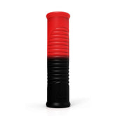 Red and black silicone novelty docking sleeve with ribbed texture and rounded ends on white background.