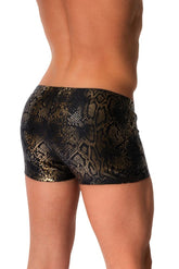 Rear view of a man wearing MANstore Guywear black and gold snakeskin print micro swim shorts.