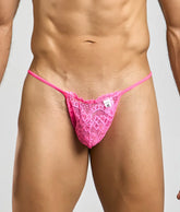 MOB men’s lace thong in bright pink with delicate floral patterns and a small white brand tag