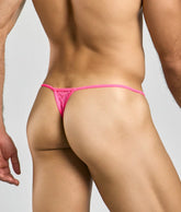Mob men’s lace thong in bright pink with intricate lace pattern and thin elastic waistband shown from the back