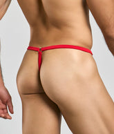 Back view of a red elephant thong with a thin smooth fabric waistband and small metallic clasp closure