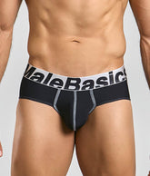 Black malebasics microfiber brief with white waistband, bold black lettering, and silver stitching along seams
