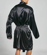 Black satin robe with belted waist and long sleeves by Malebasics shown from the back side