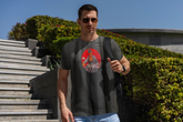 Dark gray short-sleeved t-shirt featuring a circular graphic of a man on a motorcycle against a red background