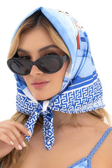 Mapale 47018 all ways scarf in santorini blue light blue and white geometric patterned headscarf worn as a fashion accessory