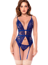 Royal blue lace teddy with plunging neckline, cutout waist, attached garter straps, and matching panties.