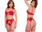 Scarlet red three-piece lingerie set with embroidered floral bra, garter belt, and matching thong with leg straps.