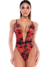 Black and red floral print teddy with a plunging V-neckline and thin straps.