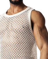 Close-up of a model wearing a cream-colored Nasty Pig Bare Knit Tank Top with an open mesh pattern.