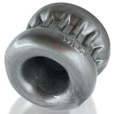 OXBALLS Core steel ball stretcher with a smooth, contoured ring shape and textured upper section.