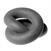 Dark gray, thick silicone wrap ring twisted into a figure-eight shape against a white background.