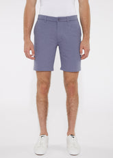 A pair of men’s tailored solid light blue stretch knit shorts with belt loops and single button closure