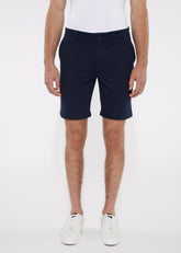 Navy blue solid stretch knit shorts with classic fit and button closure made from comfortable knit fabric