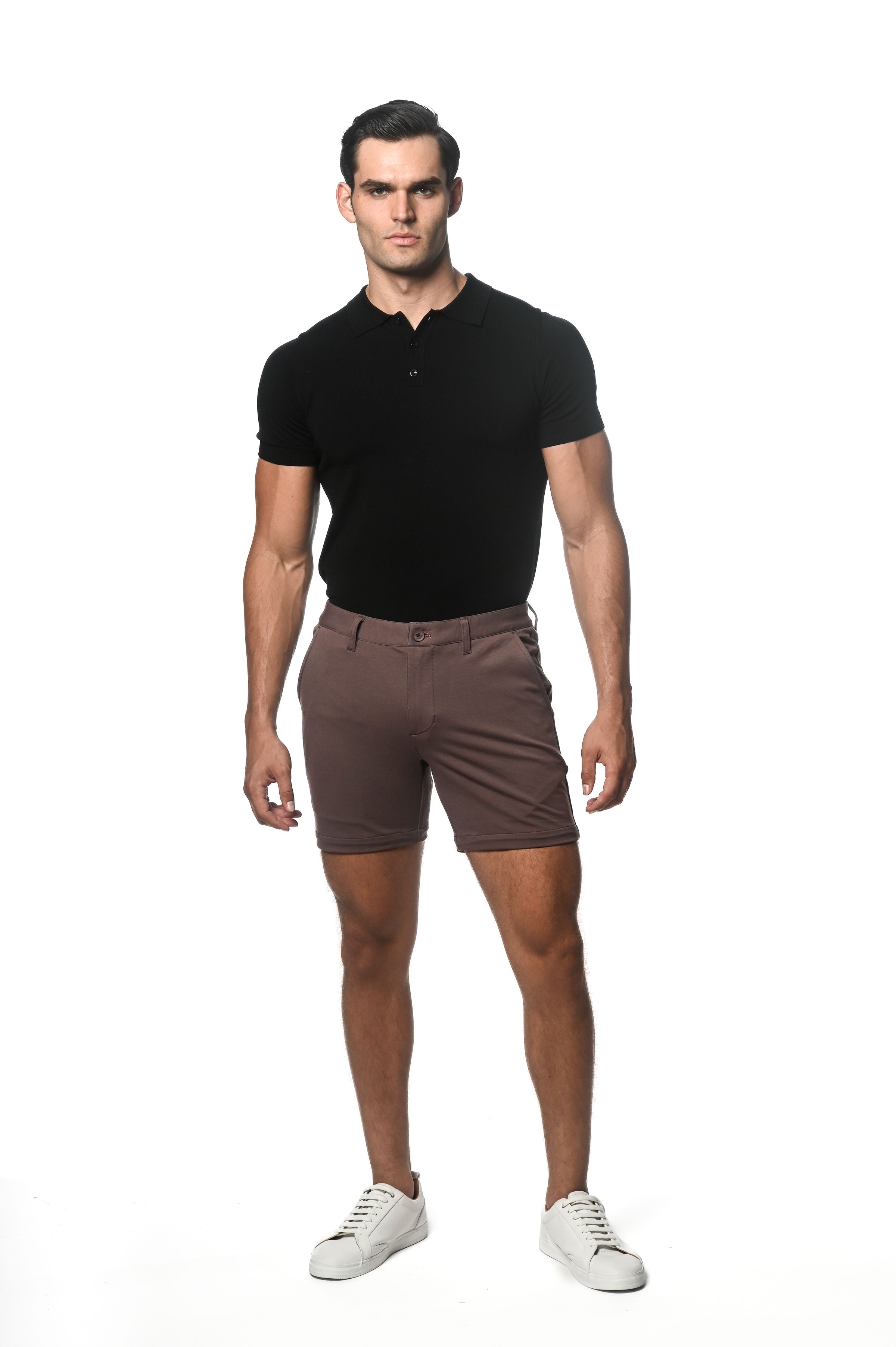 A pair of slim-fit brown textured stretch knit chino shorts with button closure and belt loops